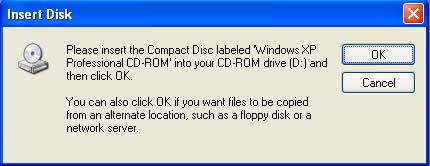 Cho dĩa CD Windows XP vào ổ dĩa